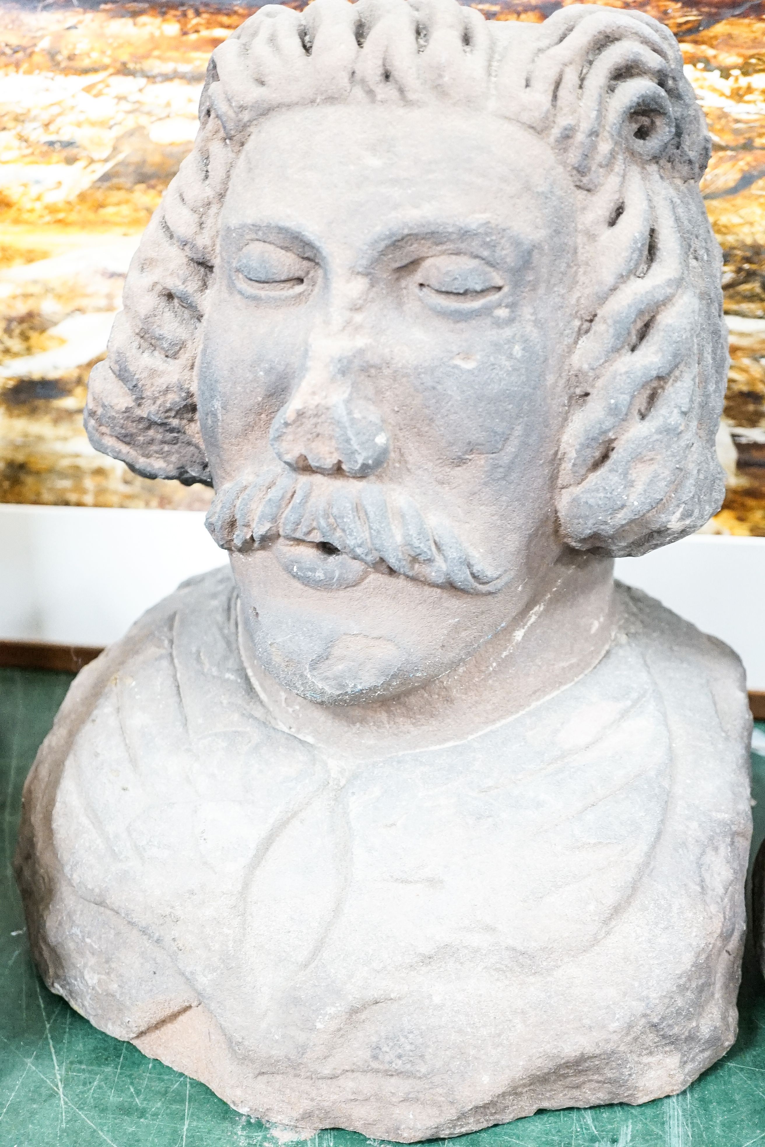 Two Tudor style red sandstone busts, and a sandstone bust of a lady, tallest 39cm